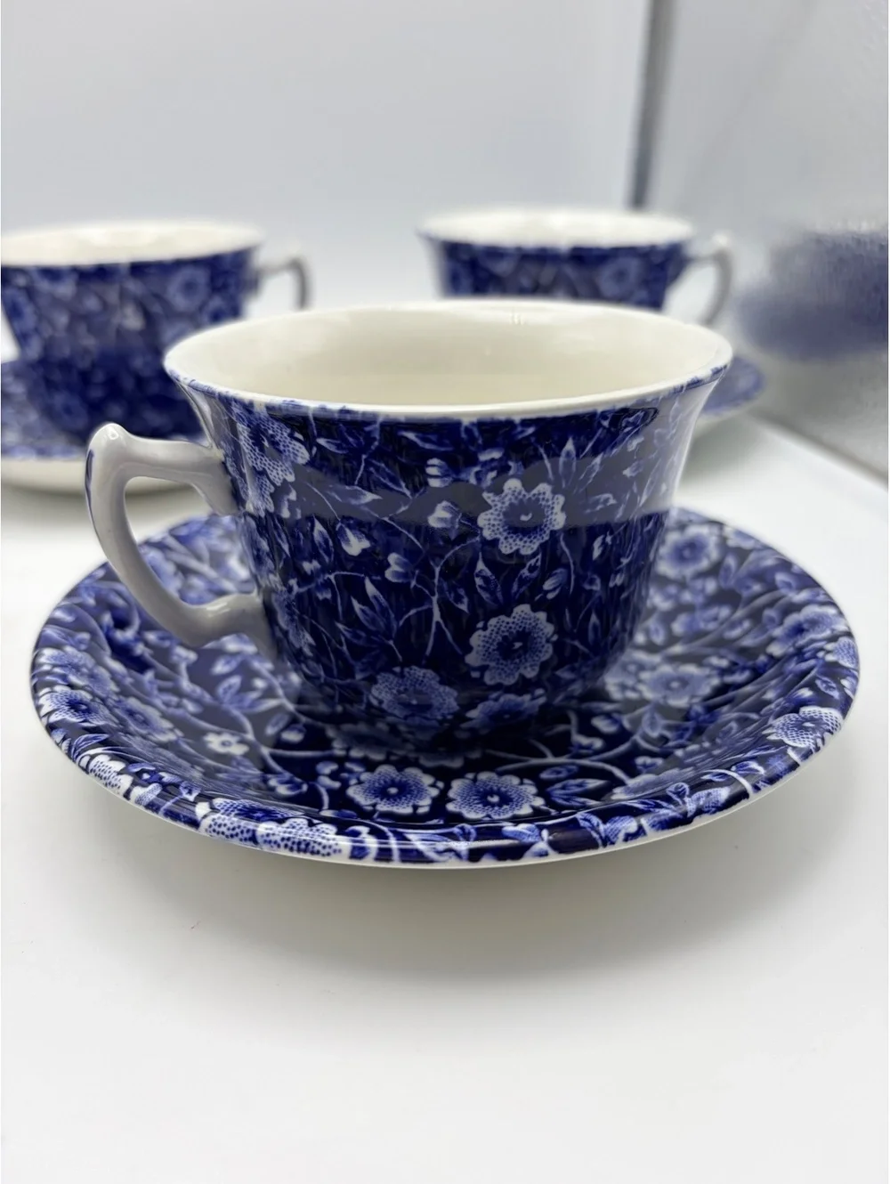 5 vintage sets of cups and saucers. Blue on white 1968 England.